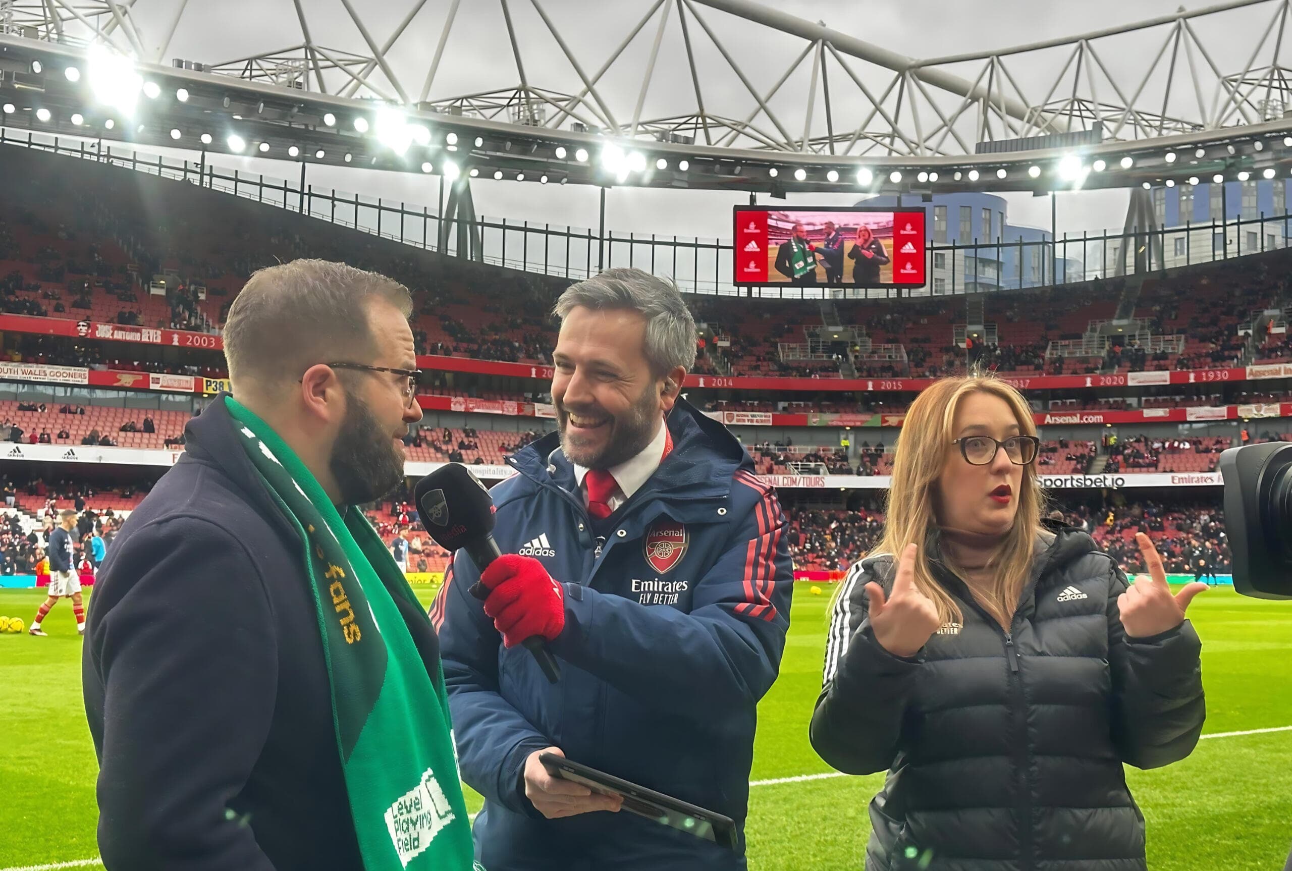 PI team pitchside at Arsenal's Emirates Stadium