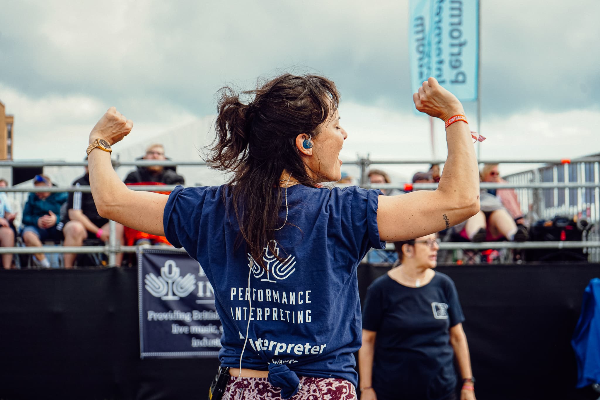 PI interpreter celebrating at a festival